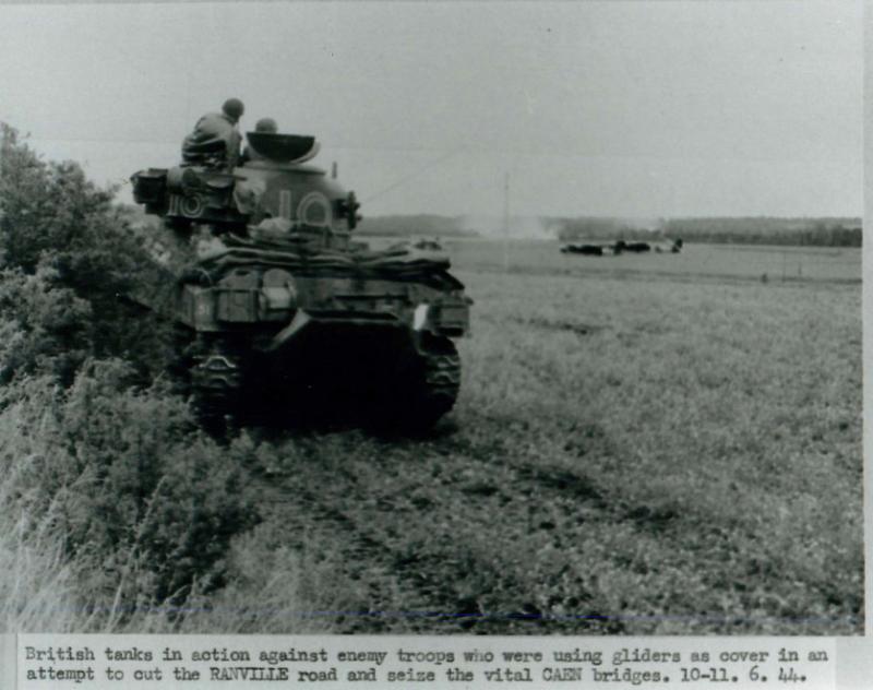 British troops engaged with enemy troops in fight for Caen bridges.