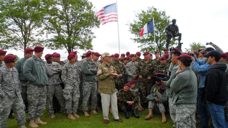 A US Airborne veteran recalls his experiences of D-Day in the shadow of the Iron Mike statue overlooking La Fiere DZ
