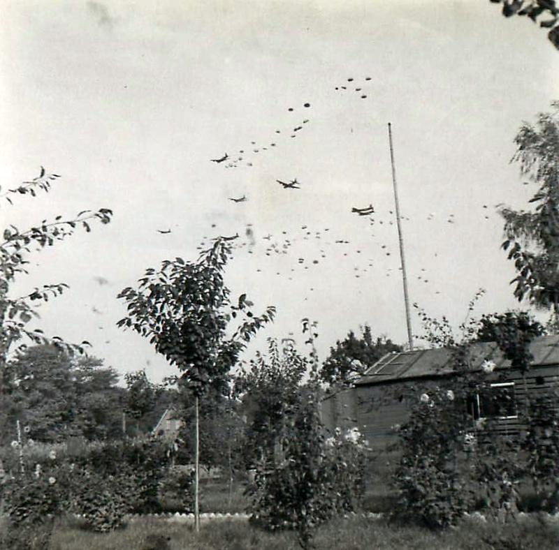 Four-engined Stirlings dropping supplies by parachute to Airborne Forces.