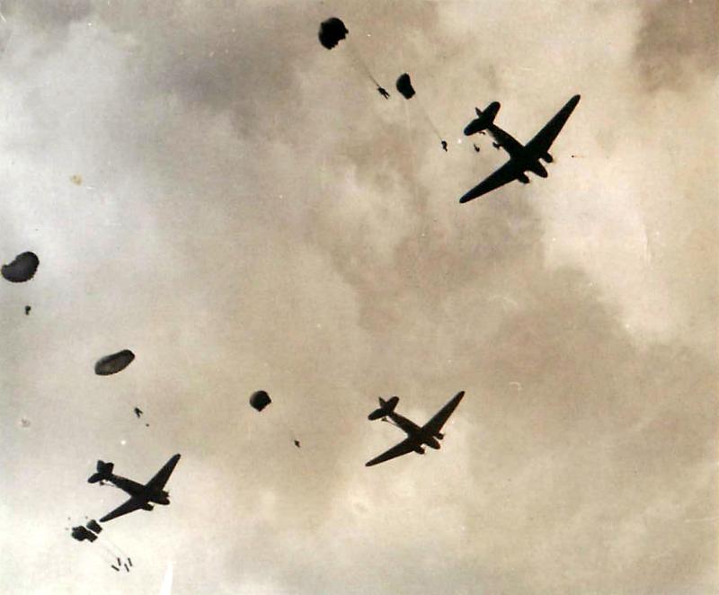 Three aircraft dropping containers for re-supply at Arnhem