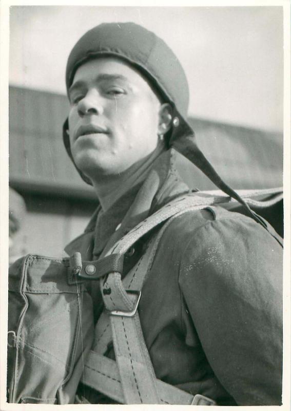 Early paratrooper looks at the camera prior to a training exercise.