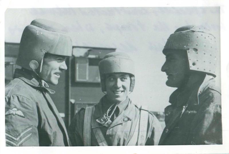 Three paratroopers wearing early experimental head protection.