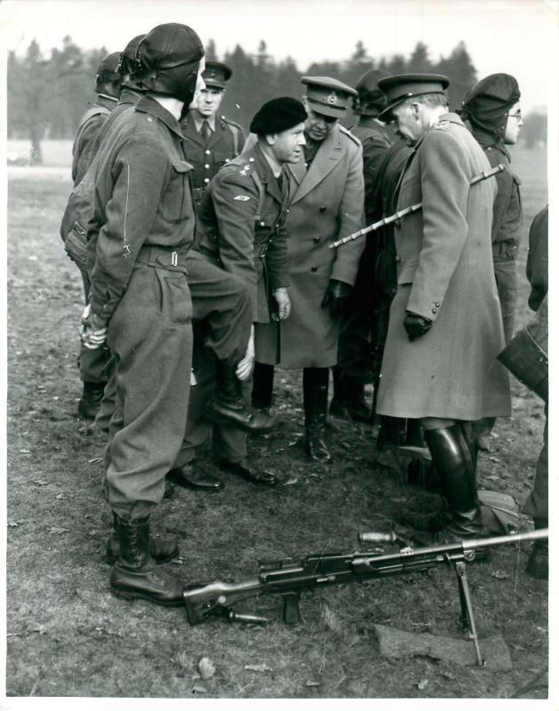 General Sir John Dill inspects the boots worn by paratroopers.